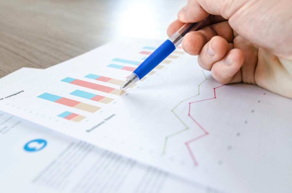 A financial graph with upward-trending lines, illustrating how a transaction coordinator can boost efficiency and lead to higher financial returns in real estate transactions.